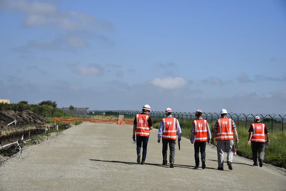 Engineering team walking an active construction site at Campia Turzii, Romania