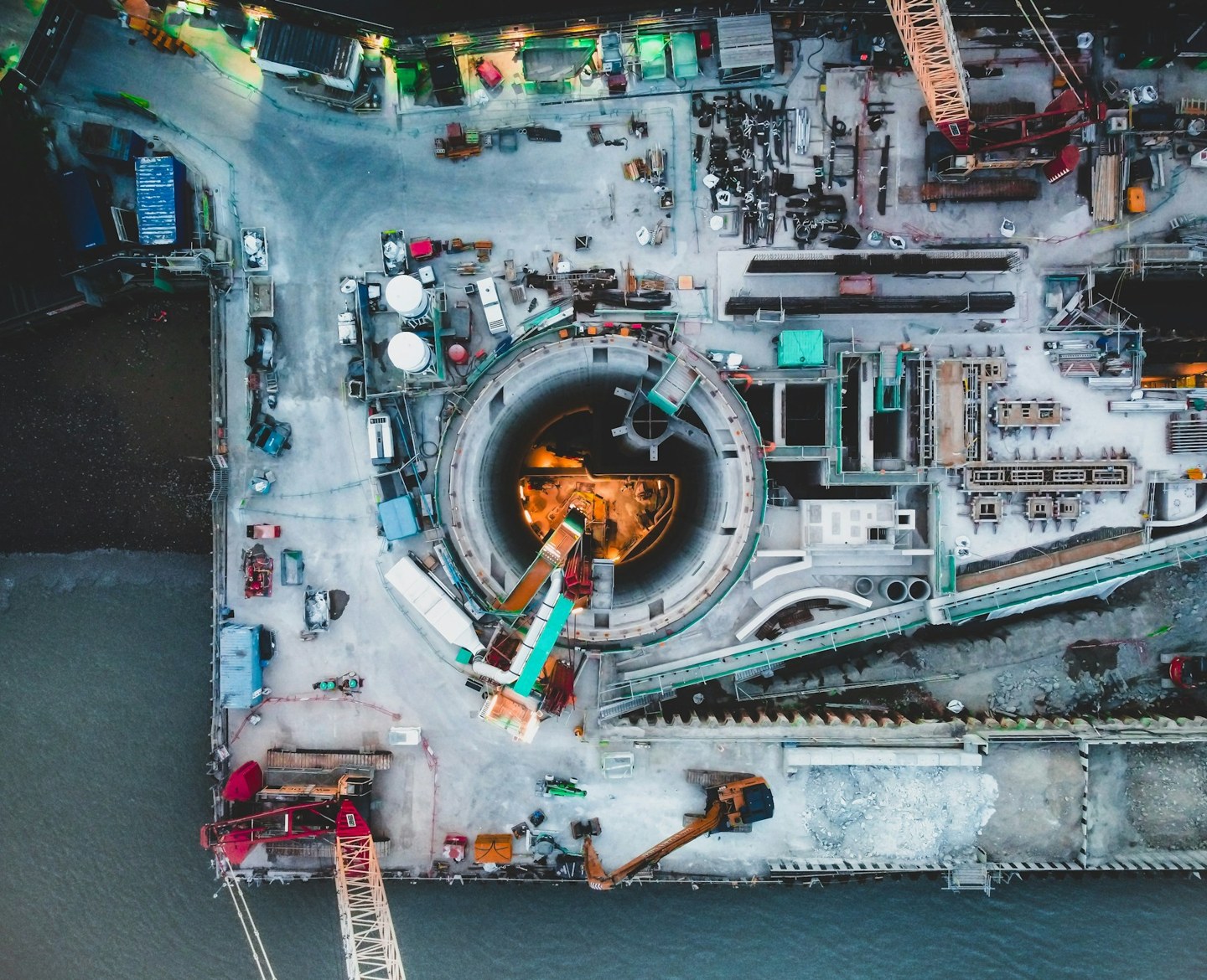 Overhead view into the circular Tideway sewer shaft and construction compound at King Edward Memorial Park in London